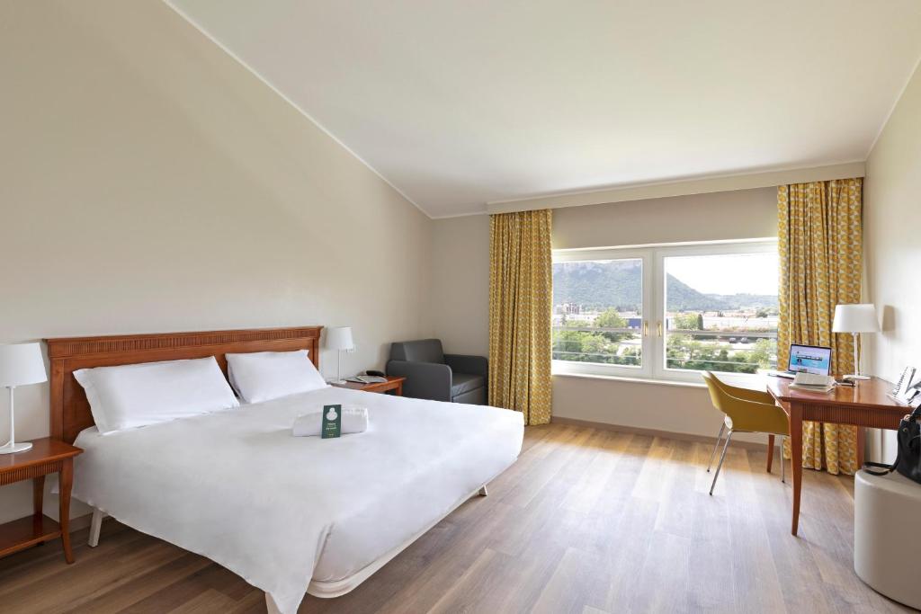Letto o letti in una camera di B&B Hotel Affi - Lago di Garda