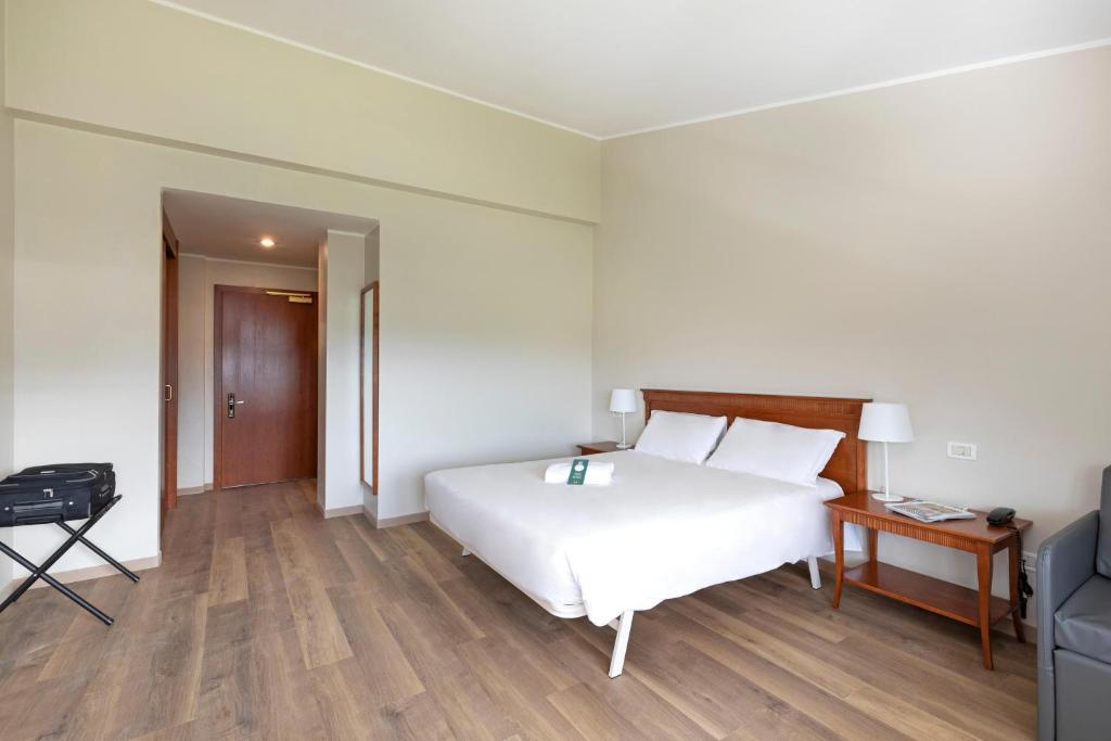 Letto o letti in una camera di B&B Hotel Affi - Lago di Garda