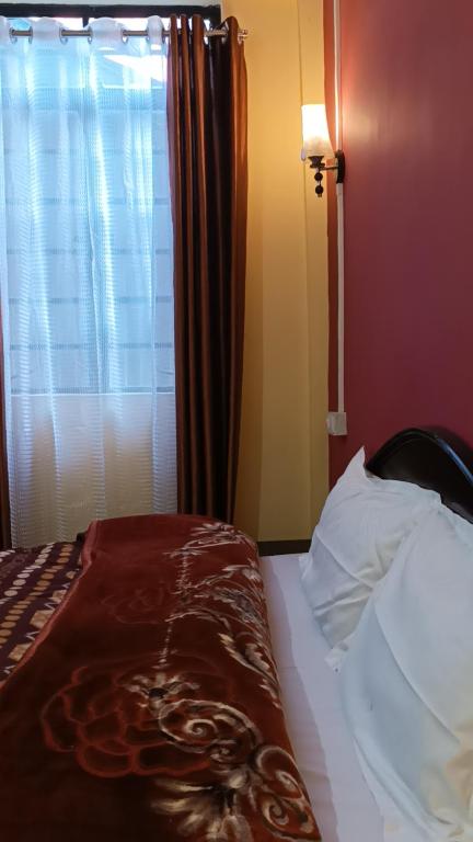 Postel nebo postele na pokoji v ubytování Banabas Homestay