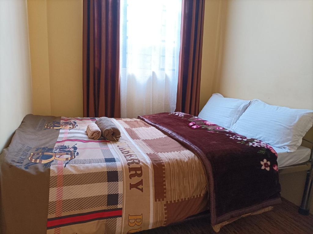 Postel nebo postele na pokoji v ubytování Banabas Homestay