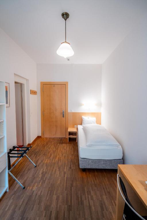 Postel nebo postele na pokoji v ubytování Hotel Haus Schönstatt contactless-Check-In