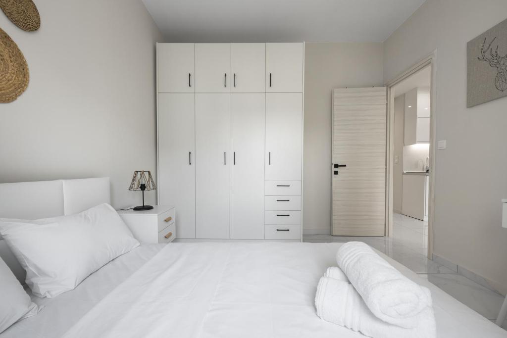 Łóżko lub łóżka w pokoju w obiekcie Aelia Apartments, The Luxury Suites
