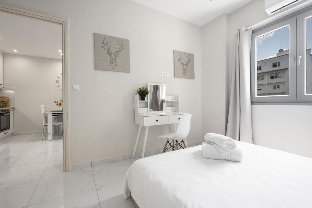 Łóżko lub łóżka w pokoju w obiekcie Aelia Apartments, The Luxury Suites