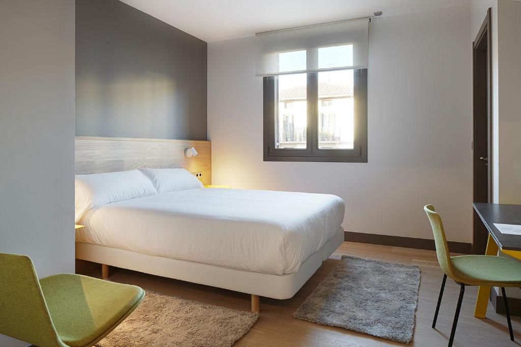 Postel nebo postele na pokoji v ubytování Hotel Imaz