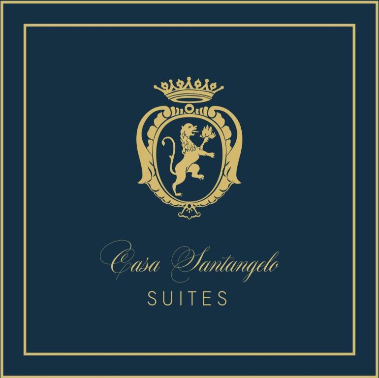 a crest with a lion and a crown on a blue background at Casa Santangelo Suites in Salerno