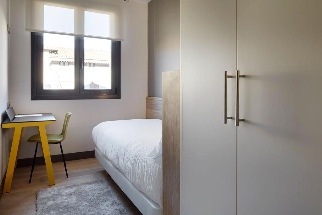 Postel nebo postele na pokoji v ubytování Hotel Imaz
