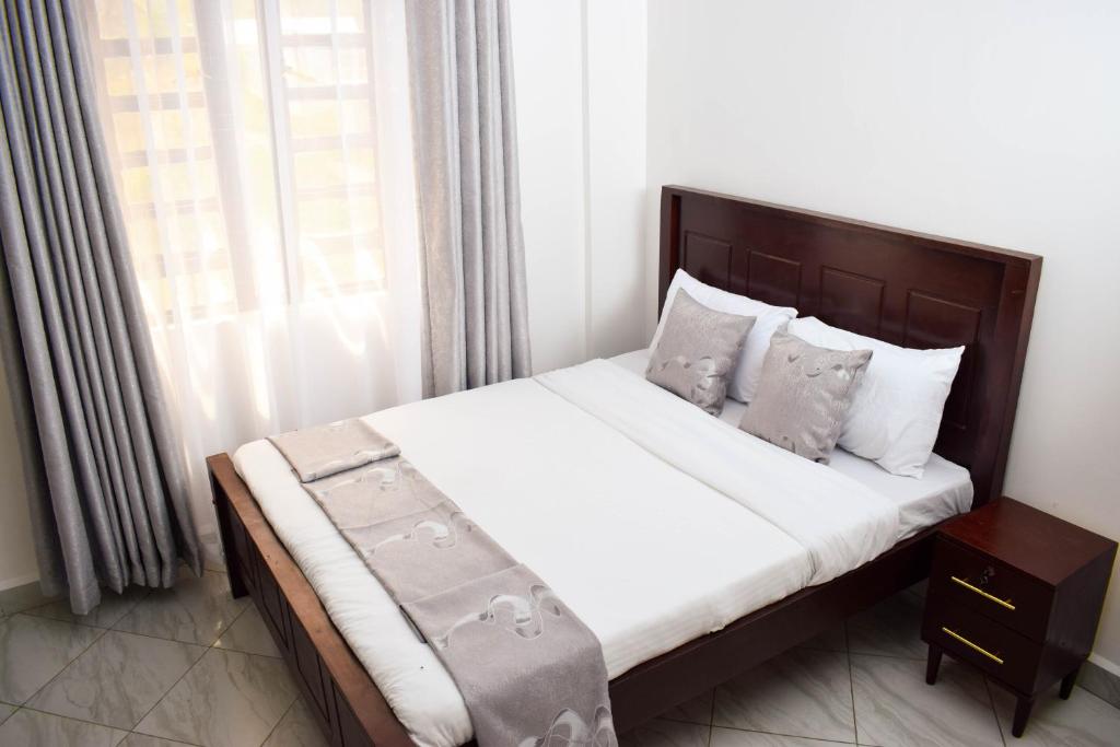 Postel nebo postele na pokoji v ubytování Mzinyi Homes
