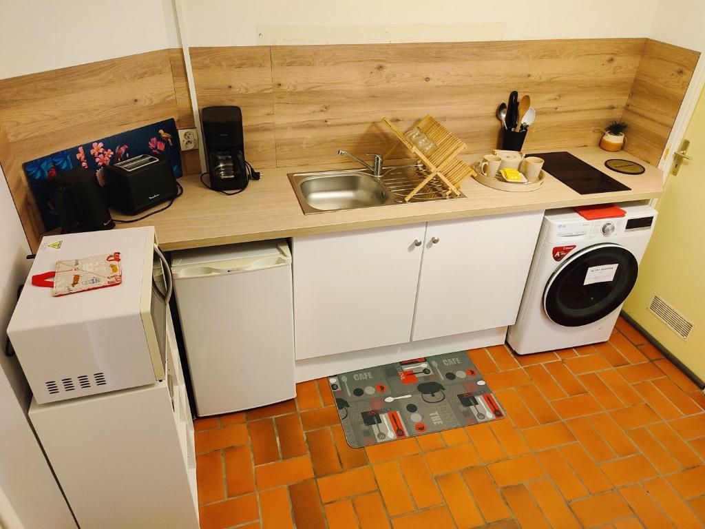 Kuchyň nebo kuchyňský kout v ubytování Gîte Bienvenue chez Naty
