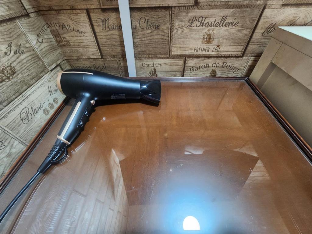 a gun on the floor of a bowling alley at Suyu Station Motel in Seoul