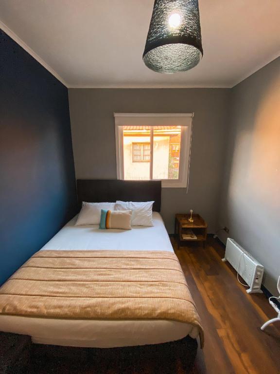 Postel nebo postele na pokoji v ubytování TQCaleta Providencia Barrio Italia