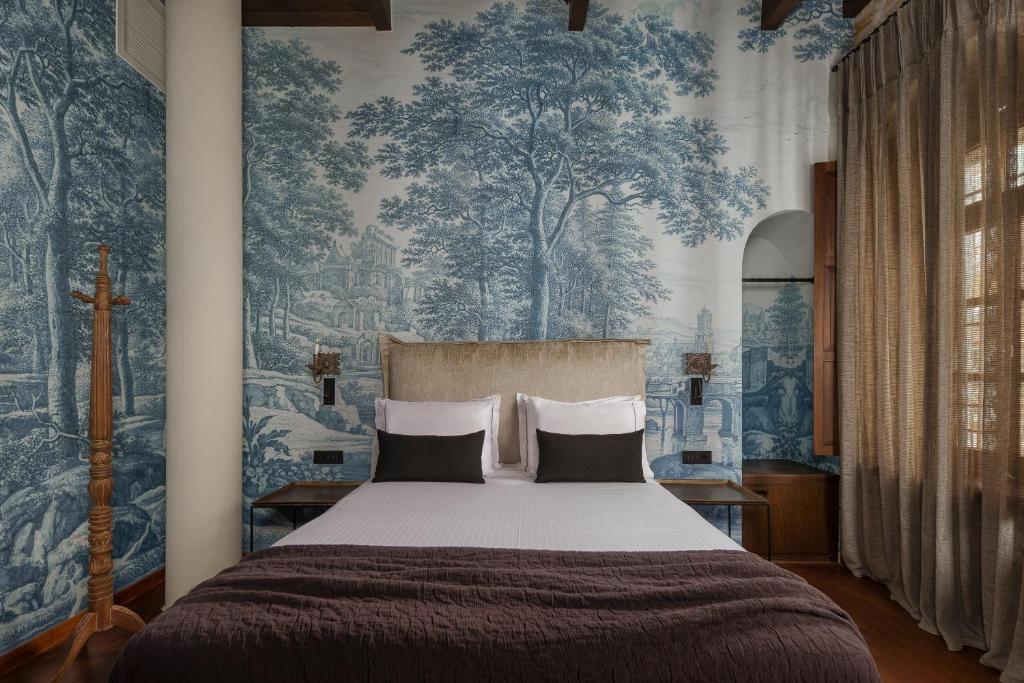 Postel nebo postele na pokoji v ubytování Stoes Boutique Hotel