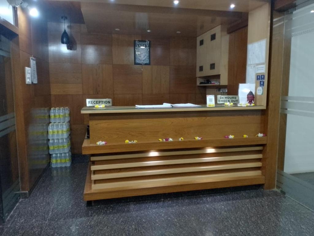 a store with a counter in a store at Shrinivas Lodge in Dhārwād
