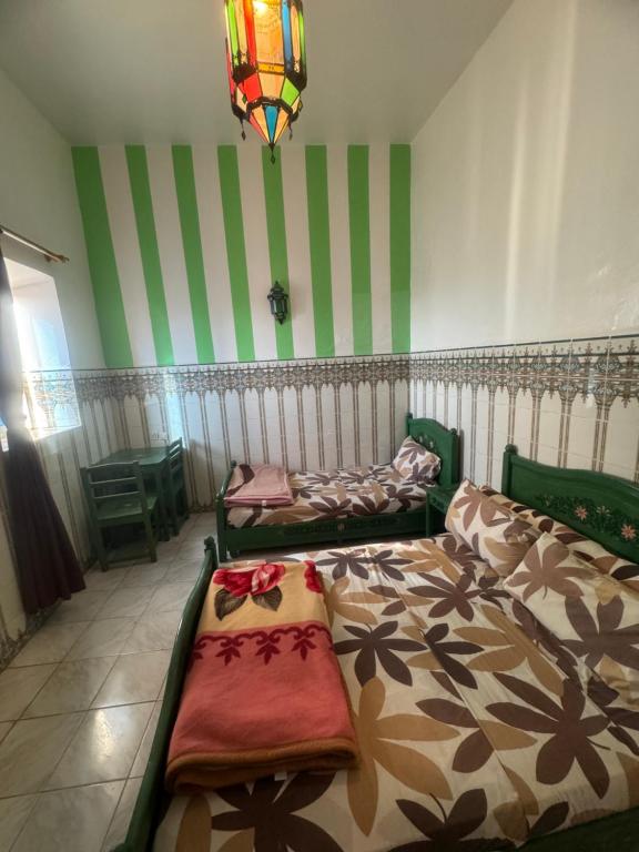 Postel nebo postele na pokoji v ubytování Hotel majestc
