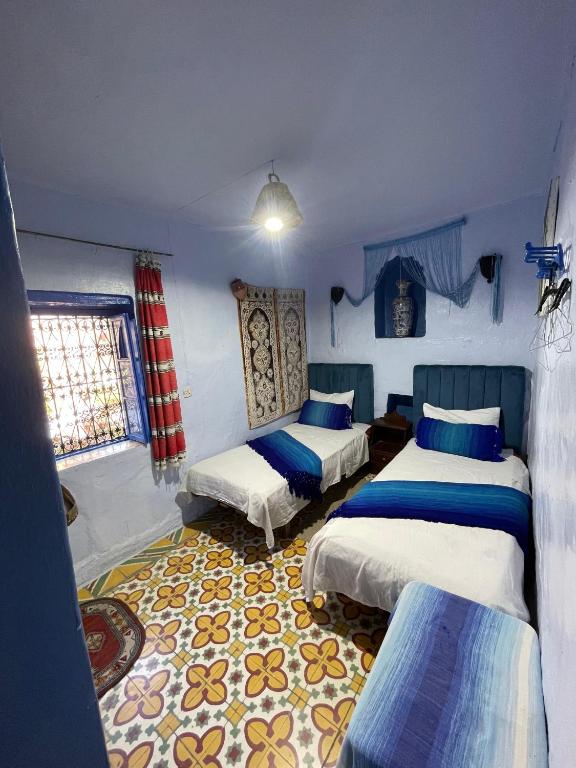 Postel nebo postele na pokoji v ubytování Hôtel Barcelona