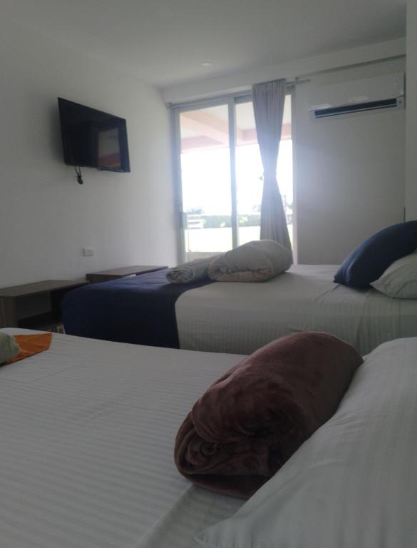Postel nebo postele na pokoji v ubytování HOTEl PALO GRANDE CF PEREIRA