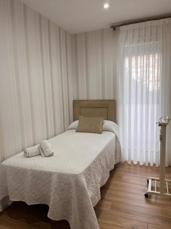 Posteľ alebo postele v izbe v ubytovaní Apartamento Orilla de Triana