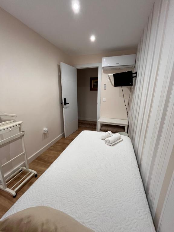 Posteľ alebo postele v izbe v ubytovaní Apartamento Orilla de Triana