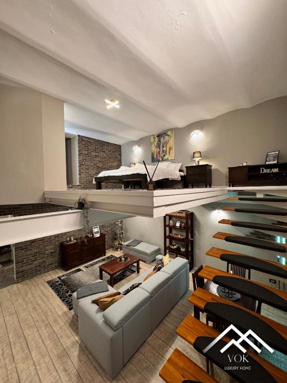 a living room with a couch and a bed at VOK Luxury Home I City Loft I Central Arad in Arad