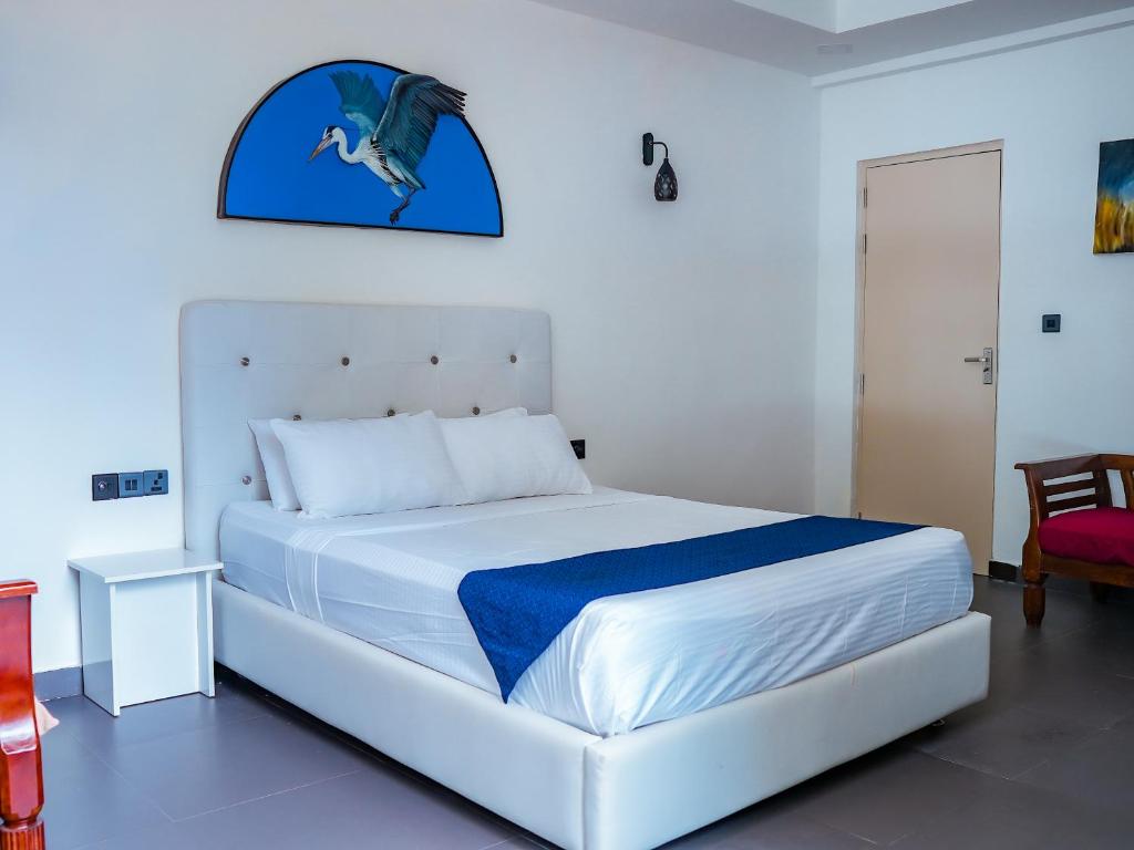 Postel nebo postele na pokoji v ubytování Silver Oasis Maldives