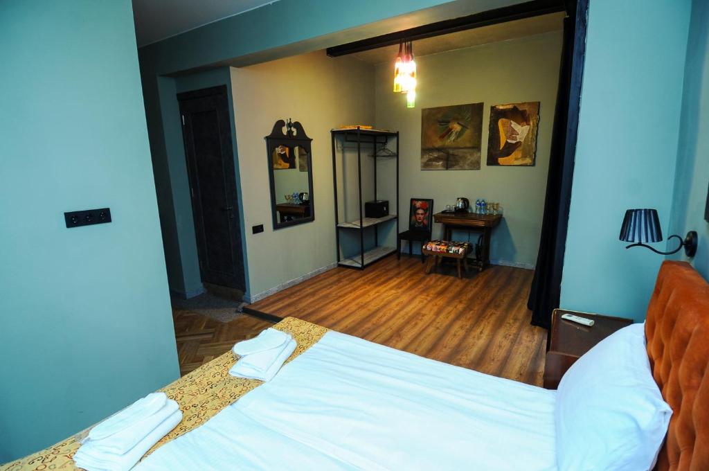 Postel nebo postele na pokoji v ubytování Art Hotel Home
