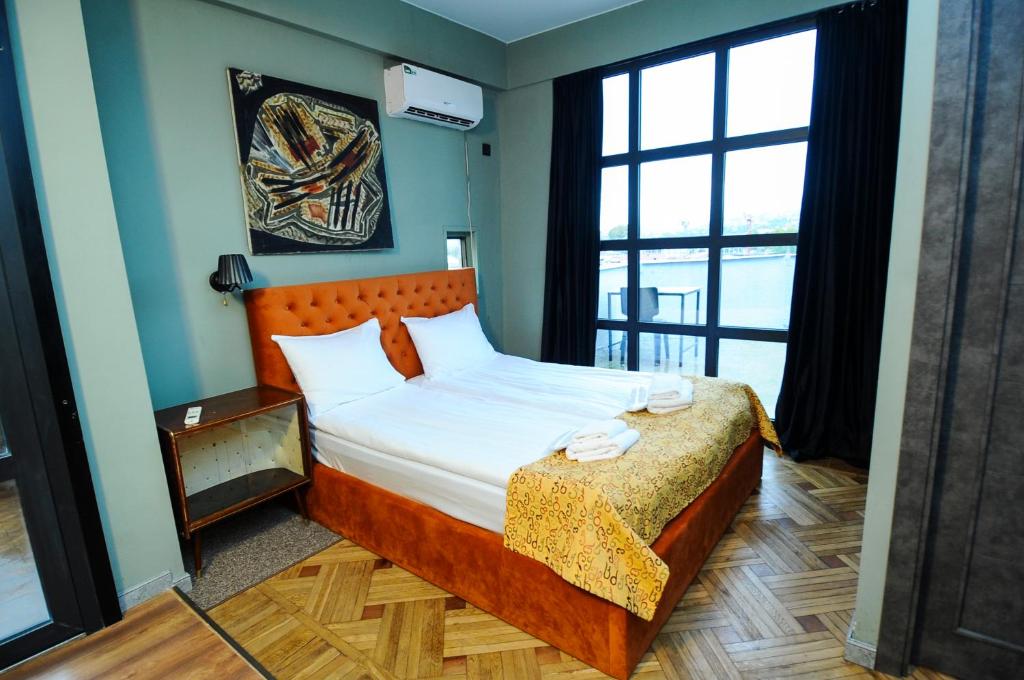 Postel nebo postele na pokoji v ubytování Art Hotel Home