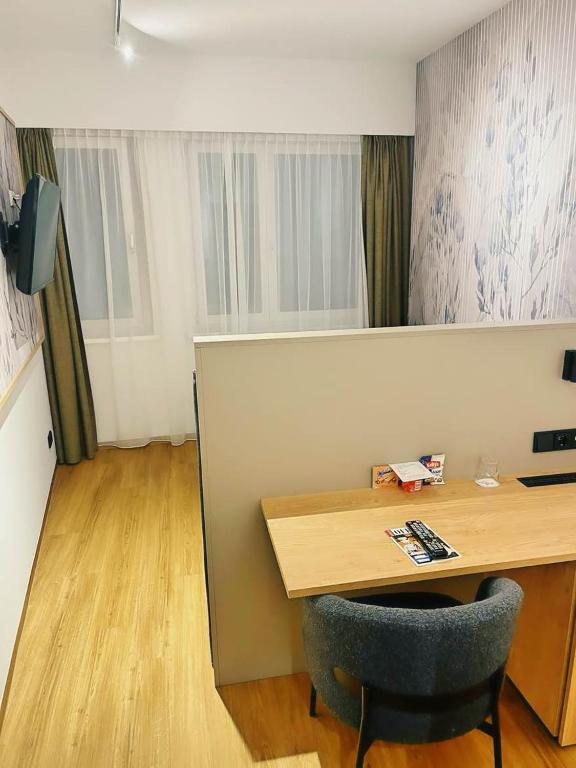 TV a/nebo společenská místnost v ubytování Hotel Hecher