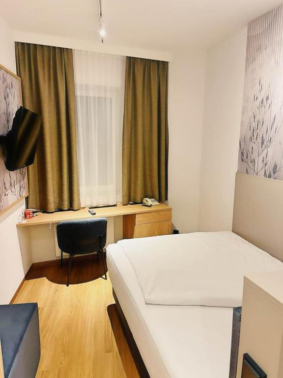 TV a/nebo společenská místnost v ubytování Hotel Hecher