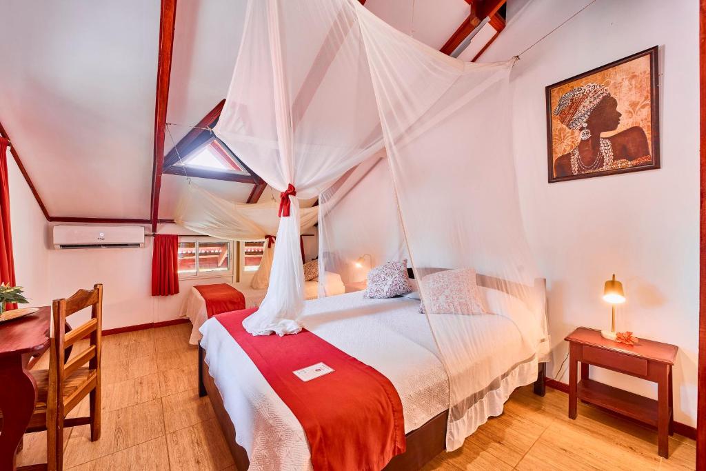 Postel nebo postele na pokoji v ubytování Hotel El Encanto