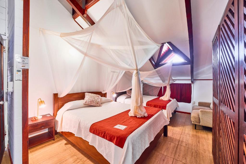 Postel nebo postele na pokoji v ubytování Hotel El Encanto