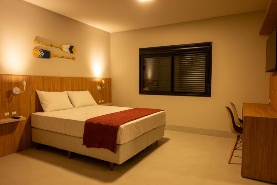 Cama ou camas em um quarto em Pousada Caminho do Bosque