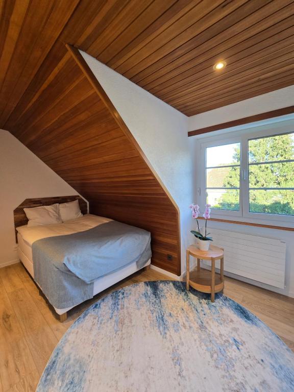 Letto o letti in una camera di Appartement confortable à deux pas de l'EPFL - l'UNIL