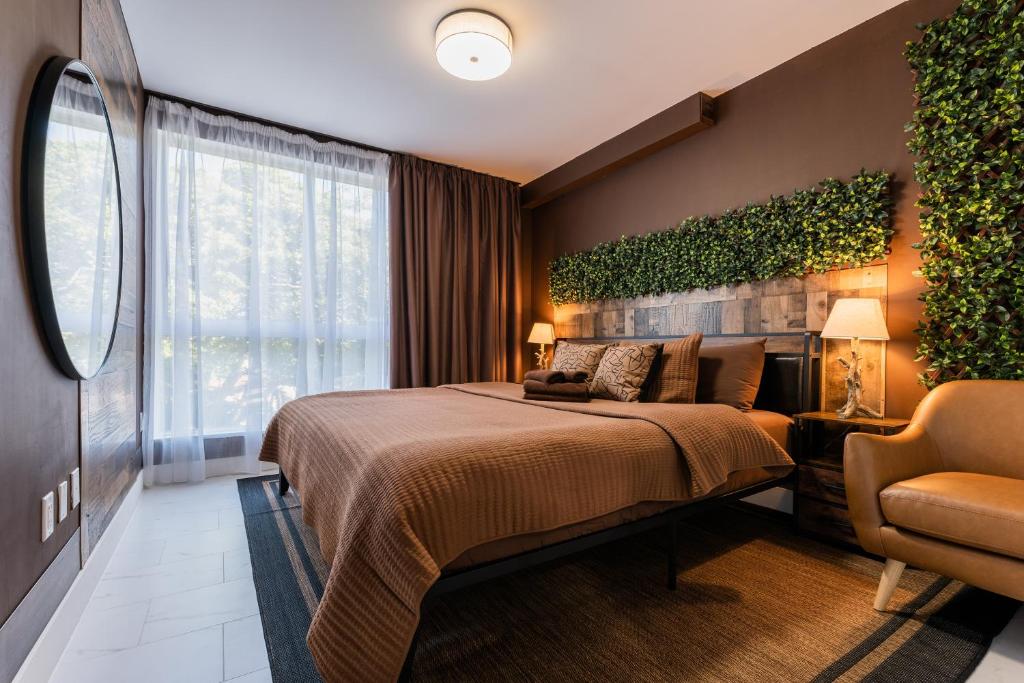a hotel room with a bed and a chair at MIAMI WOOD APART HOTEL NEW 2025 - PRIVATE TERRACE - Parking - Beach 5 min in Hollywood