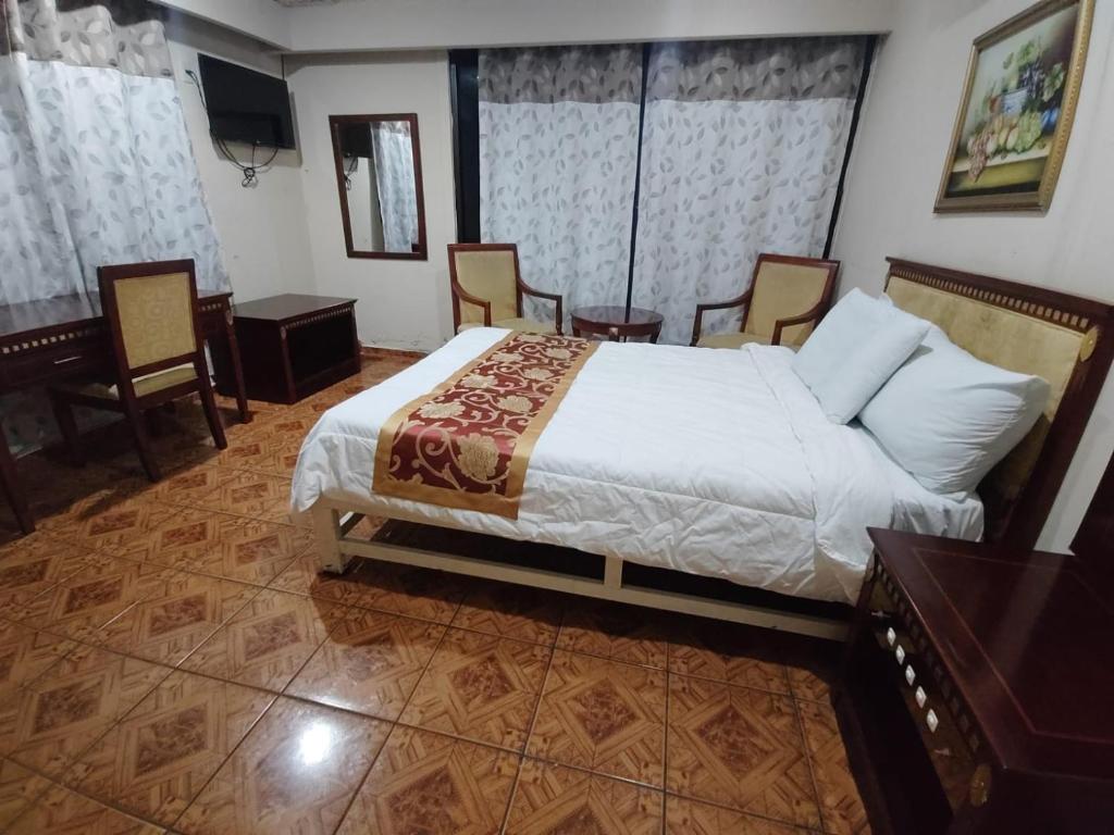 Postel nebo postele na pokoji v ubytování Hotel Mandarin