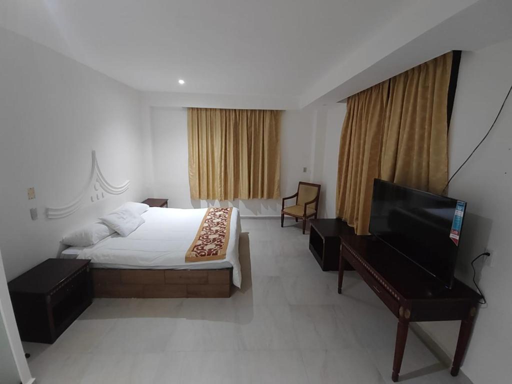 Postel nebo postele na pokoji v ubytování Hotel Mandarin