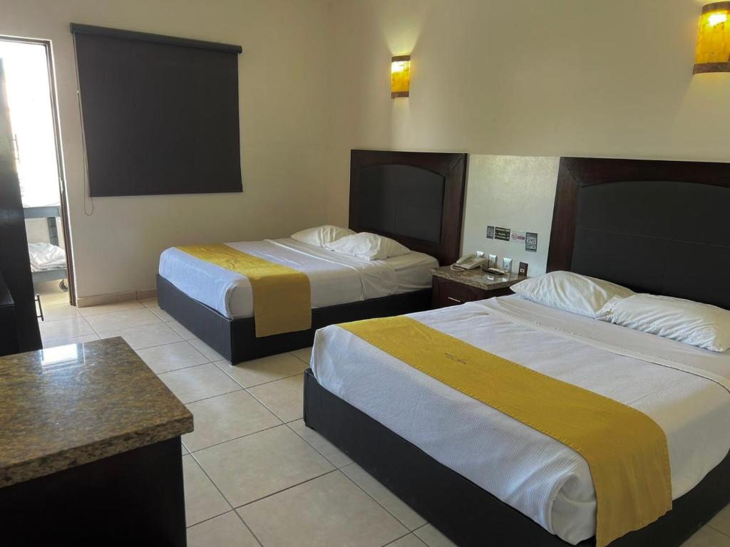 Postel nebo postele na pokoji v ubytování Hotel Maioris Guadalajara