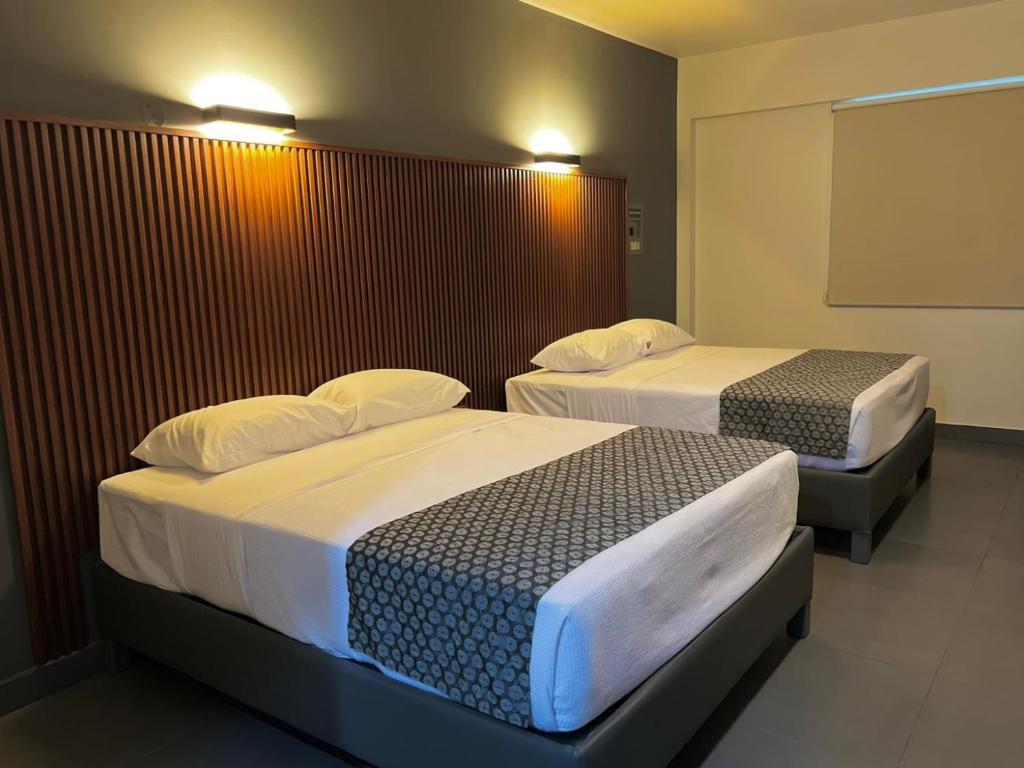 Postel nebo postele na pokoji v ubytování Hotel Maioris Guadalajara