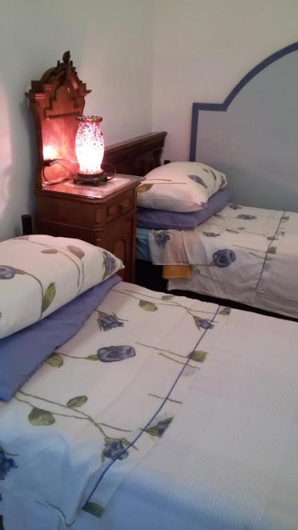 Postel nebo postele na pokoji v ubytování Villa Fiorita