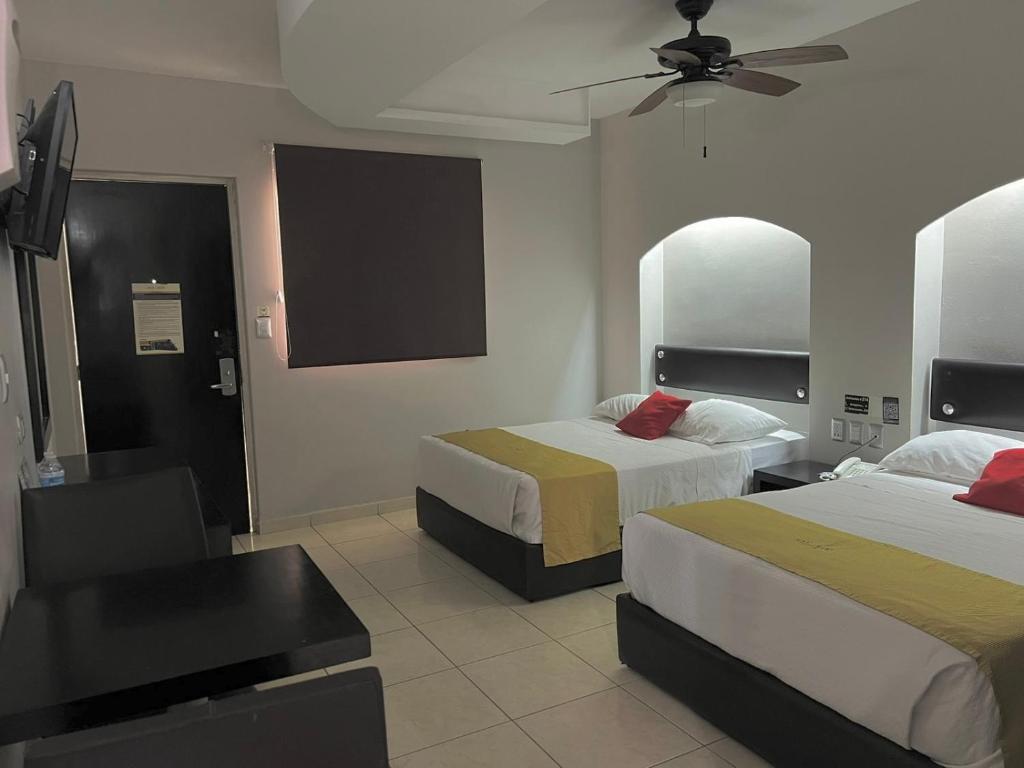 Postel nebo postele na pokoji v ubytování Hotel Maioris Guadalajara