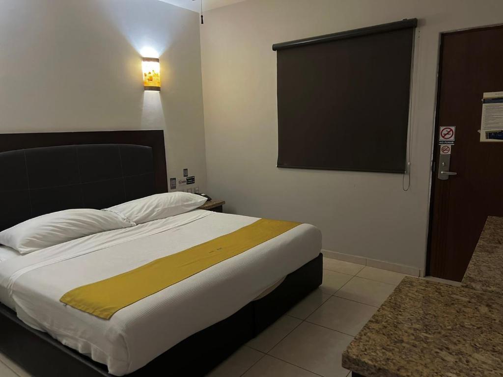 Postel nebo postele na pokoji v ubytování Hotel Maioris Guadalajara
