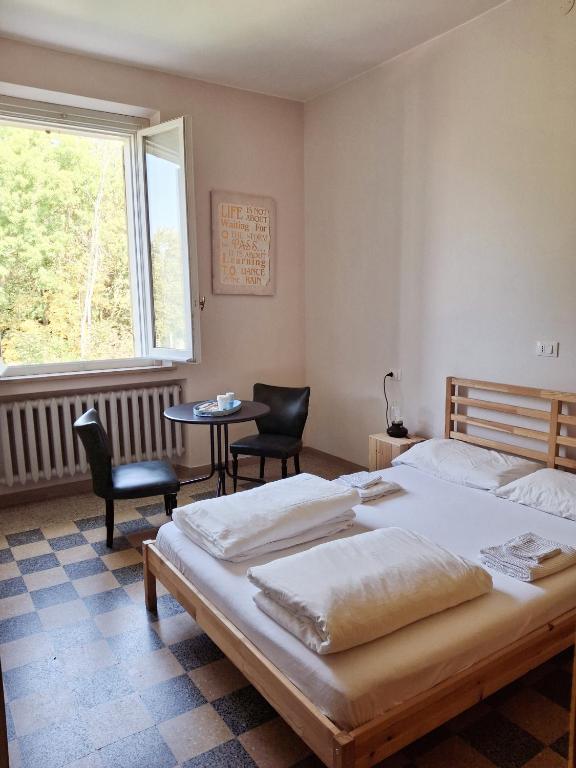 Postel nebo postele na pokoji v ubytování Nessun dorma b&b Pesaro
