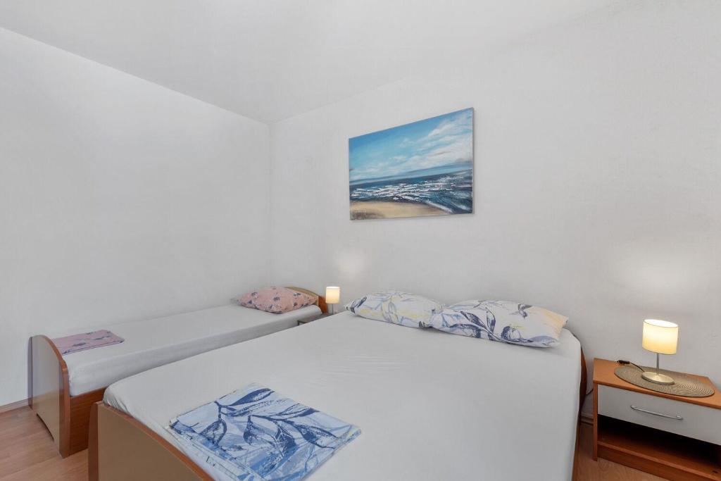 Postel nebo postele na pokoji v ubytování Apartment Uga2