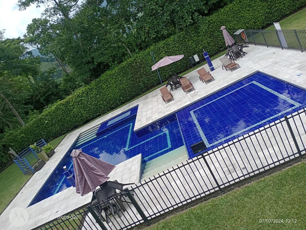 Bazén v ubytování HOTEl PALO GRANDE CF PEREIRA nebo v jeho okolí