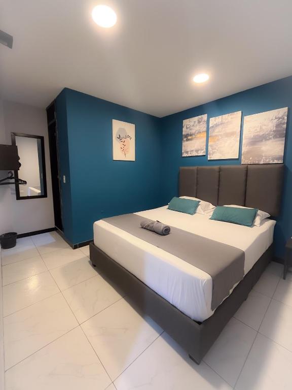 Postel nebo postele na pokoji v ubytování Hotel HILLS BOGOTA