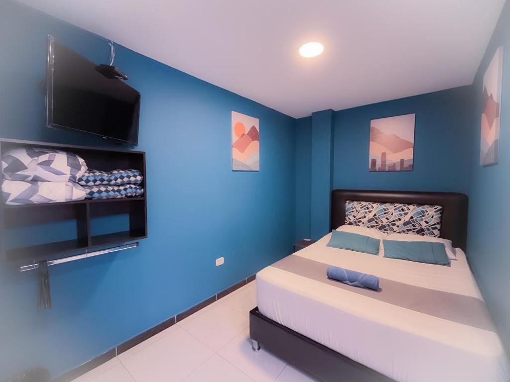 Postel nebo postele na pokoji v ubytování Hotel HILLS BOGOTA