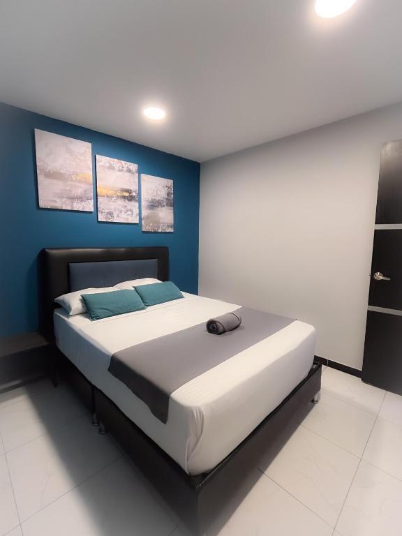 Postel nebo postele na pokoji v ubytování Hotel HILLS BOGOTA