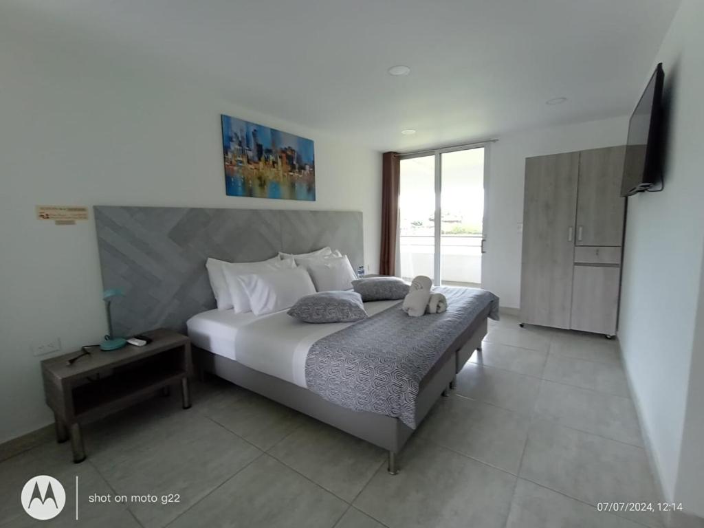 Postel nebo postele na pokoji v ubytování HOTEl PALO GRANDE CF PEREIRA