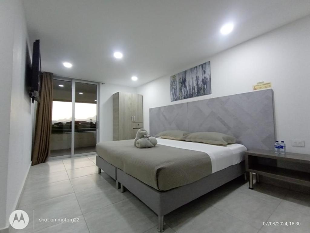 Postel nebo postele na pokoji v ubytování HOTEl PALO GRANDE CF PEREIRA