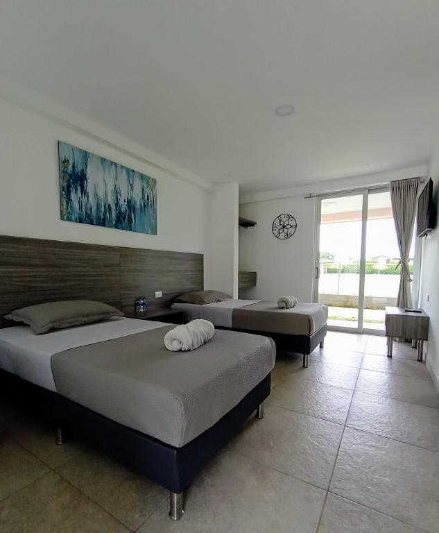 Postel nebo postele na pokoji v ubytování HOTEl PALO GRANDE CF PEREIRA