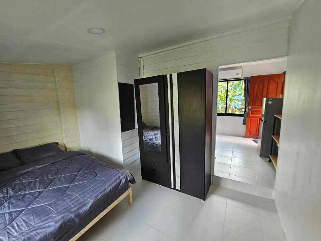 Postel nebo postele na pokoji v ubytování Baan Nok Koh Chang
