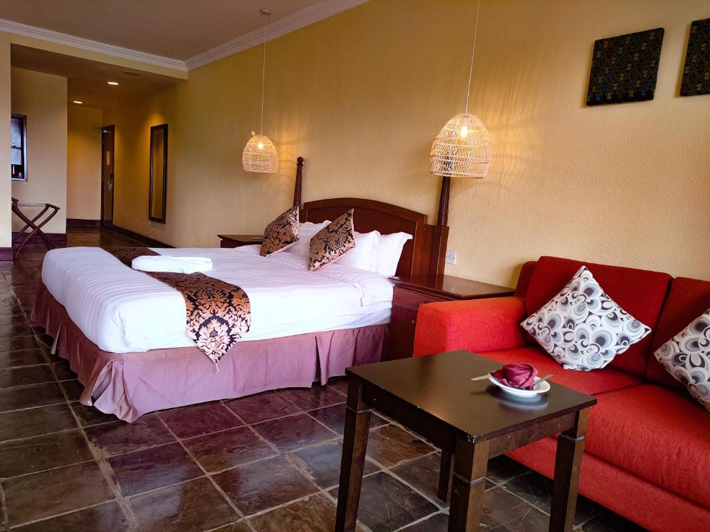 Postel nebo postele na pokoji v ubytování Palm Beach Resort & SPA